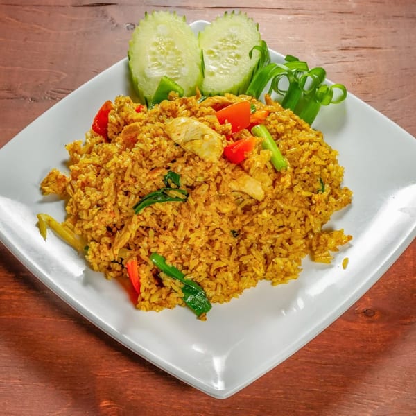 Mai Thai Noodles & Sushi's yellow curry fried rice with chicken, red peppers, and green onions.