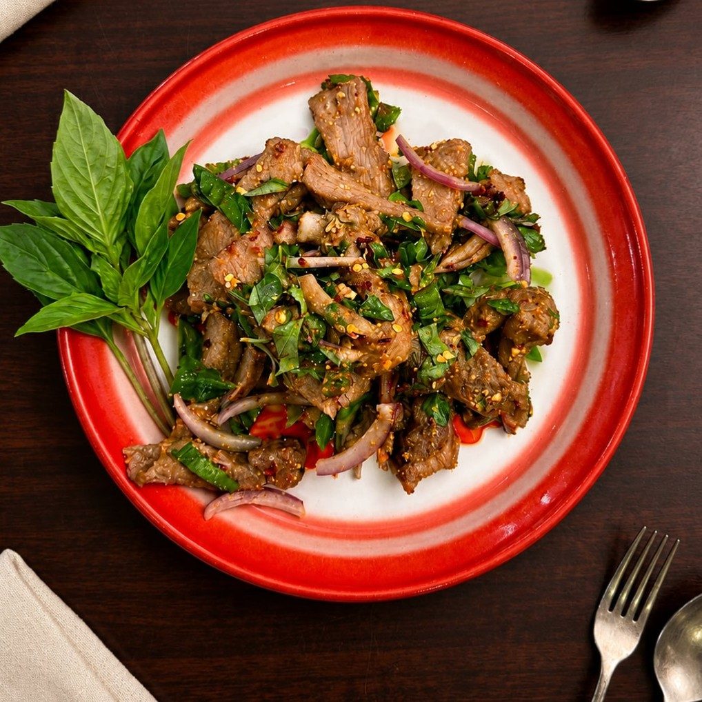 Grilled Pork "Nam Tok Salad Juicy".